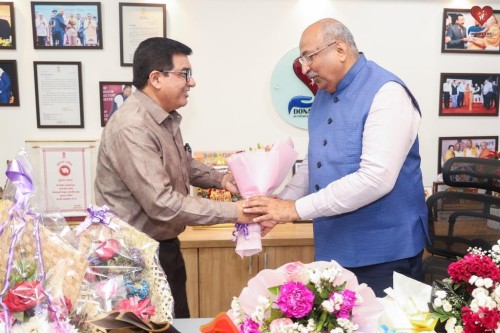 Devendra Garuda congratulated Nileshbhai Mandlewala after the announcement of the Padma Shri award by the Government of India.